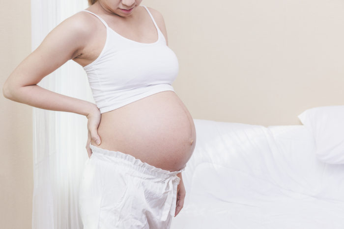 Ryggsmerter under graviditet ved bruk av varmepute